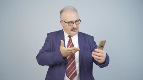 Video-of-businessman-making-video-call-on-phone.